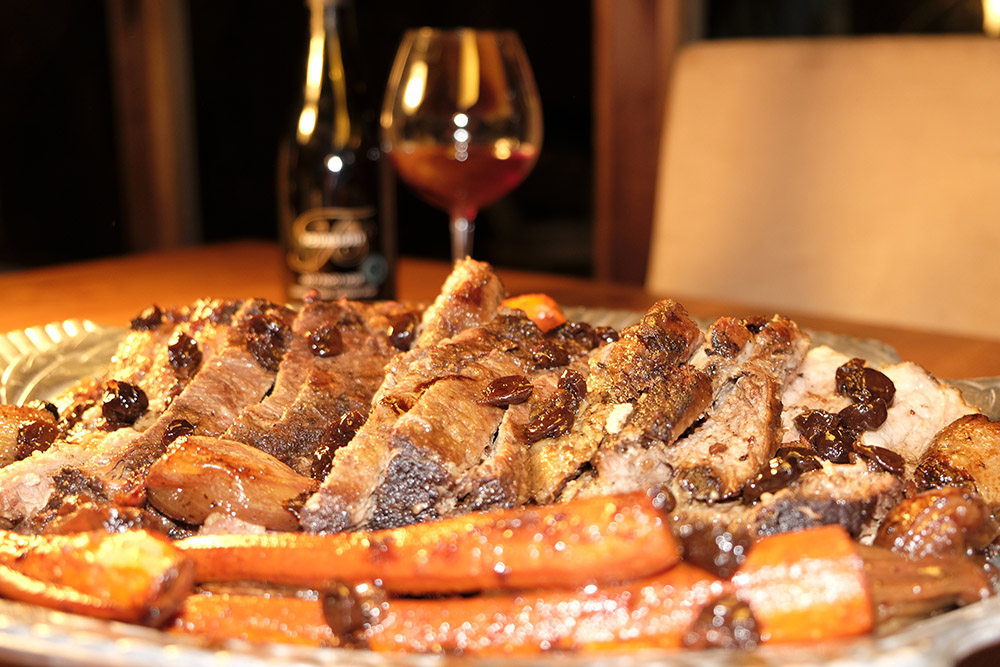 Wine Braised Brisket in front of a glass of Pinot